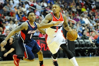 May 15, 2015; Washington, DC, USA; Washington Wizards guard Bradley Beal (3) dribbles past Atlanta Hawks guard Jeff Teague (0) during the second half in game six of the second round of the NBA Playoffs at Verizon Center. Mandatory Credit: Brad Mills-USA T