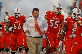 MIAMI GARDENS, FL - SEPTEMBER 5: Head coach Al Golden of the Miami Hurricanes leads the players onto the field for their game against the Bethune-Cookman Wildcats on September 5, 2015 at Sun Life Stadium in Miami Gardens, Florida. Miami defeated Bethune-C