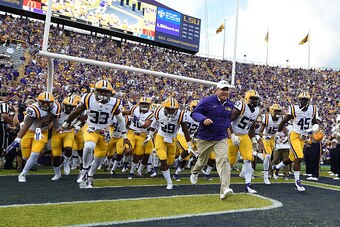 BATON ROUGE, LA - SEPTEMBER 05:  Head coach Les Miles of the LSU Tigers leads his team onto the field prior to a game against the McNeese State Cowboys at Tiger Stadium on September 5, 2015 in Baton Rouge, Louisiana.  (Photo by Stacy Revere/Getty Images)