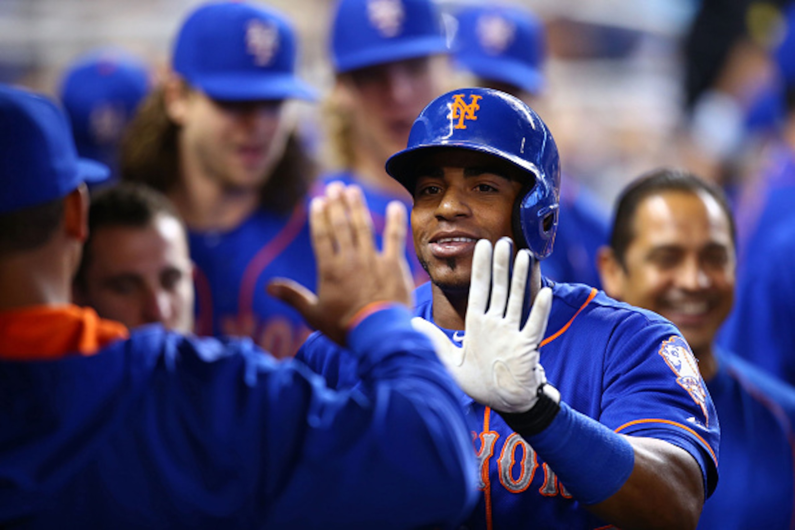MIAMI, FL - SEPTEMBER 06: Yoenis Cespedes #52 of the New York Mets celebrates with teammates after hitting a solo home run during the first inning of the game against the Miami Marlins at Marlins Park on September 6, 2015 in Miami, Florida.  (Photo by Rob
