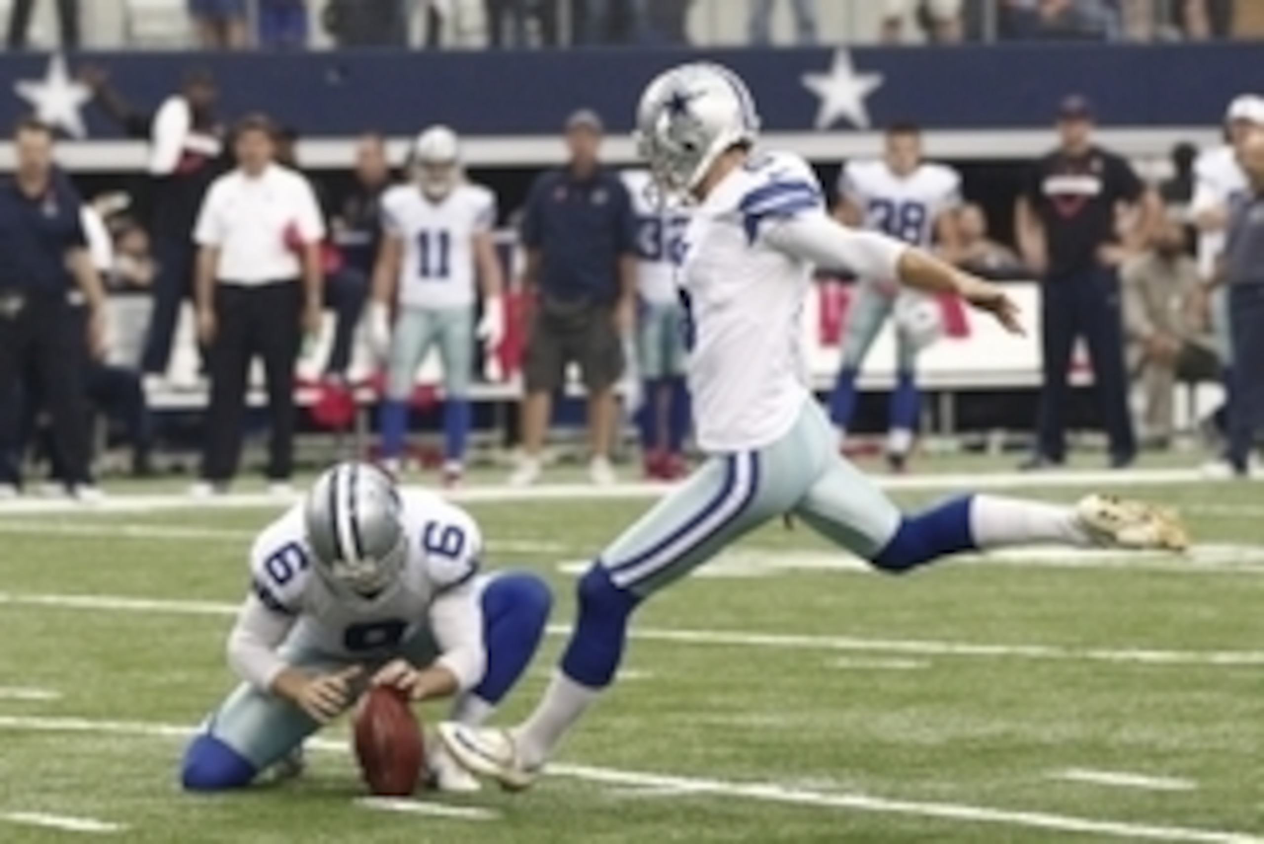 Oct 5, 2014; Arlington, TX, USA;  Dallas Cowboys kicker Dan Bailey (5) kicks the game winning field goal in overtime against the Houston Texans at AT&T Stadium. Dallas beat Houston 20-17. Mandatory Credit: Tim Heitman-USA TODAY Sports
