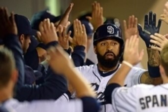 Sep 4, 2015; San Diego, CA, USA; San Diego Padres right fielder Matt Kemp (27) is congratulated after hitting a two run home run during the first inning against the Los Angeles Dodgers at Petco Park. Mandatory Credit: Jake Roth-USA TODAY Sports
