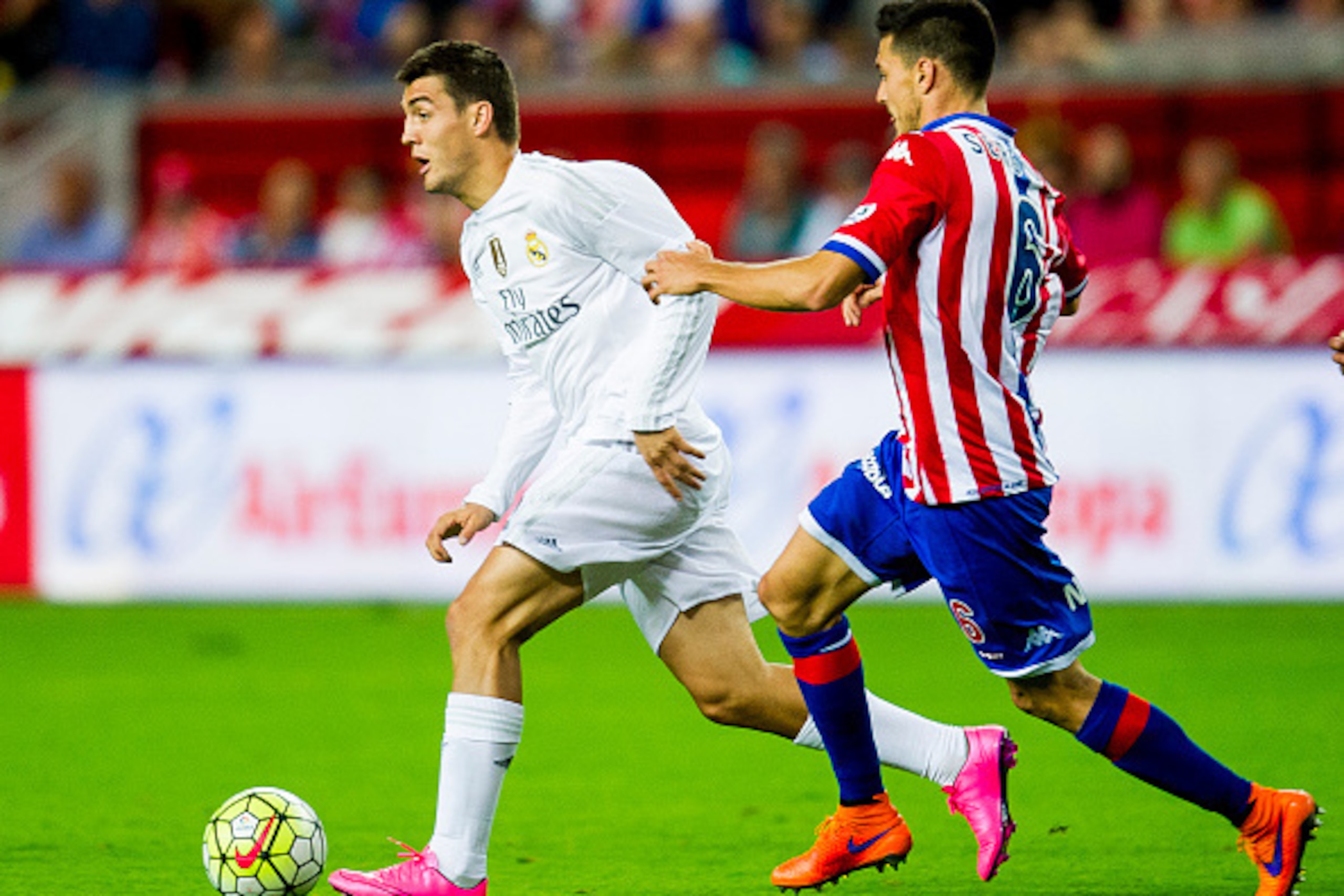 GIJON, SPAIN - AUGUST 23: Mateo Kovacic of Real Madrid duels for the ball with Sergio Alvarez of Real Sporting de Gijon during the La Liga match between Sporting Gijon and Real Madrid at Estadio El Molinon on August 23, 2015 in Gijon, Spain. (Photo by Jua GIJON, SPAIN - AUGUST 23: Mateo Kovacic of Real Madrid duels for the ball with Sergio Alvarez of Real Sporting de Gijon during the La Liga match between Sporting Gijon and Real Madrid at Estadio El Molinon on August 23, 2015 in Gijon, Spain. (Photo by Jua
