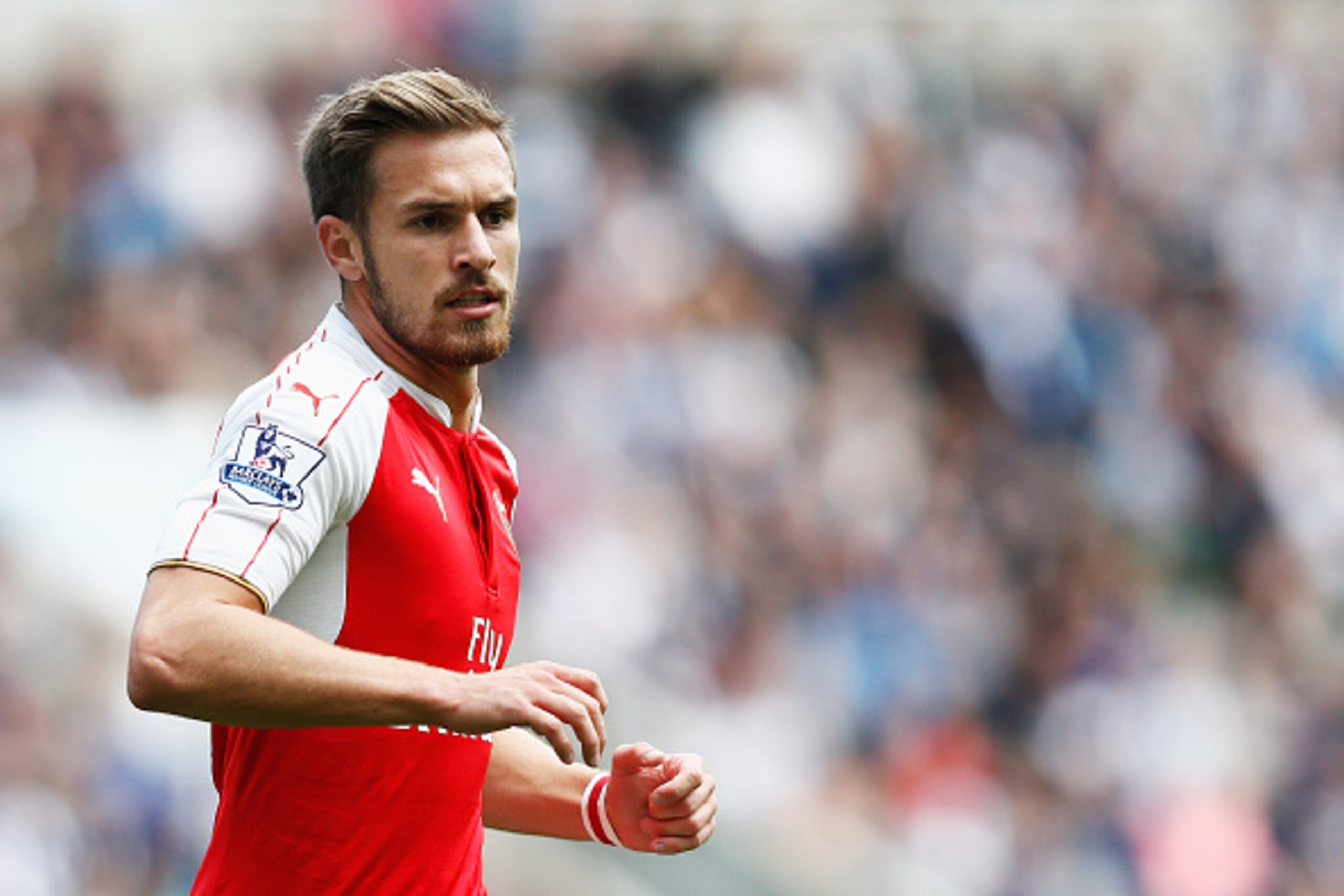 NEWCASTLE UPON TYNE, ENGLAND - AUGUST 29: Aaron Ramsey of Arsenal in action during the Barclays Premier League match between Newcastle United and Arsenal at St James' Park on August 29, 2015 in Newcastle upon Tyne, England. (Photo by Dean Mouhtaropoulos NEWCASTLE UPON TYNE, ENGLAND - AUGUST 29: Aaron Ramsey of Arsenal in action during the Barclays Premier League match between Newcastle United and Arsenal at St James' Park on August 29, 2015 in Newcastle upon Tyne, England. (Photo by Dean Mouhtaropoulos