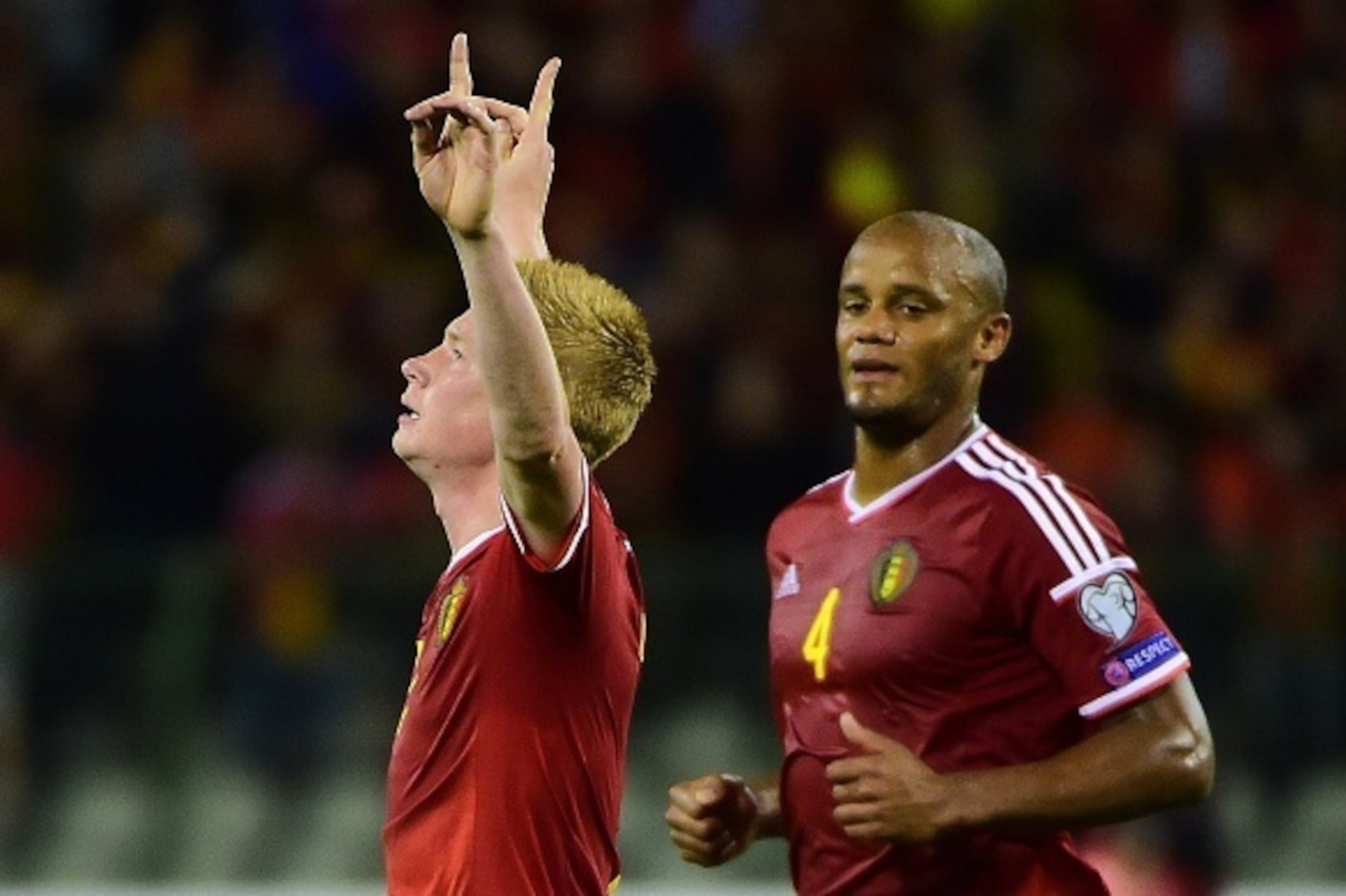 Belgium's midfielder Kevin De Bruyne (L) celebrates with Belgium's defender Vincent Kompany after scoring a goal with during the Euro 2016 qualifying match between Belgium and Bosnia and Herzegovina on September 3, 2015, at the King Baudouin Stadium in Br