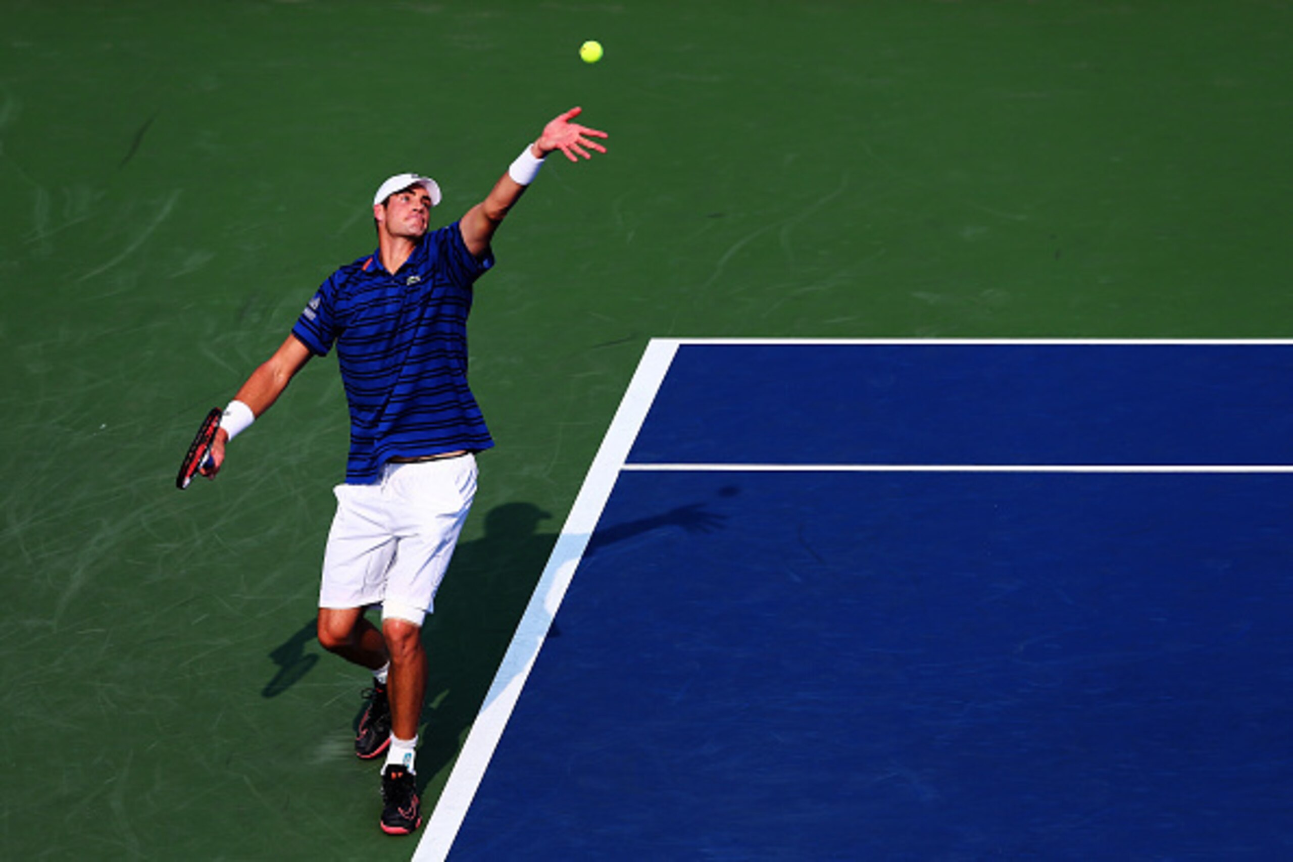 NEW YORK, NY - SEPTEMBER 03:  John Isner of the United States serves to Mikhail Youzhny of Russia during their Men's Singles Second Round match on Day Four of the 2015 US Open at the USTA Billie Jean King National Tennis Center on September 3, 2015 in the