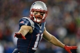 Jan 10, 2015; Foxborough, MA, USA; New England Patriots wide receiver Julian Edelman (11) sets up before the play during the 2014 AFC Divisional playoff football game against the Baltimore Ravens at Gillette Stadium. Mandatory Credit: Greg M. Cooper-USA T