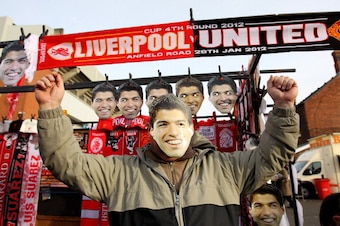 LIVERPOOL, ENGLAND - JANUARY 28:  General View of Luis Suarez of Liverpool masks and scarfs on sale outside the Kop prior to the FA Cup Fourth Round match between Liverpool and Manchester United at Anfield on January 28, 2012 in Liverpool, England.  (Phot