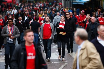 LONDON, ENGLAND - AUGUST 24: Fans walk outside the ground prior to the Barclays Premier League match between Arsenal and Liverpool at Emirates Stadium on August 24, 2015 in London, England.  (Photo by Julian Finney/Getty Images)