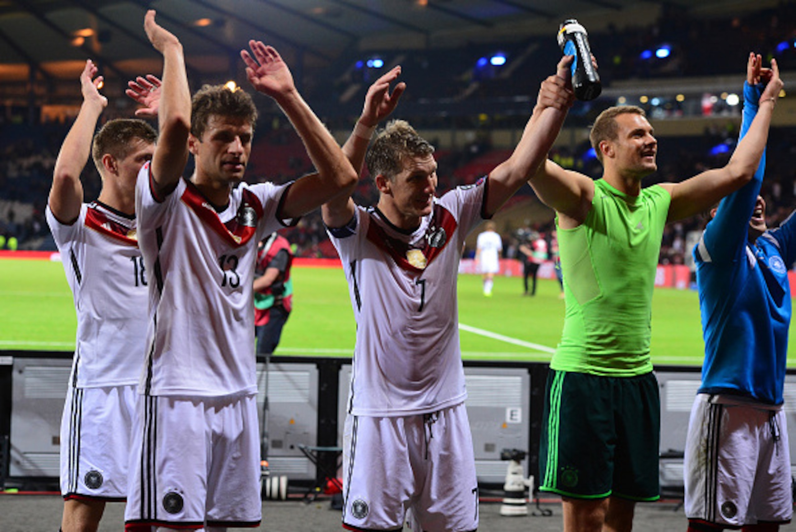 GLASGOW, SCOTLAND - SEPTEMBER 7 : Bastian Schweinsteiger, Thomas Muller and Manuel Neuer of Germany celebrate at the final whistle during the EURO 2016 Qualifier between Scotland and Germany at Hamden Park on September 7, 2015 in Glasgow, Scotland. (Photo