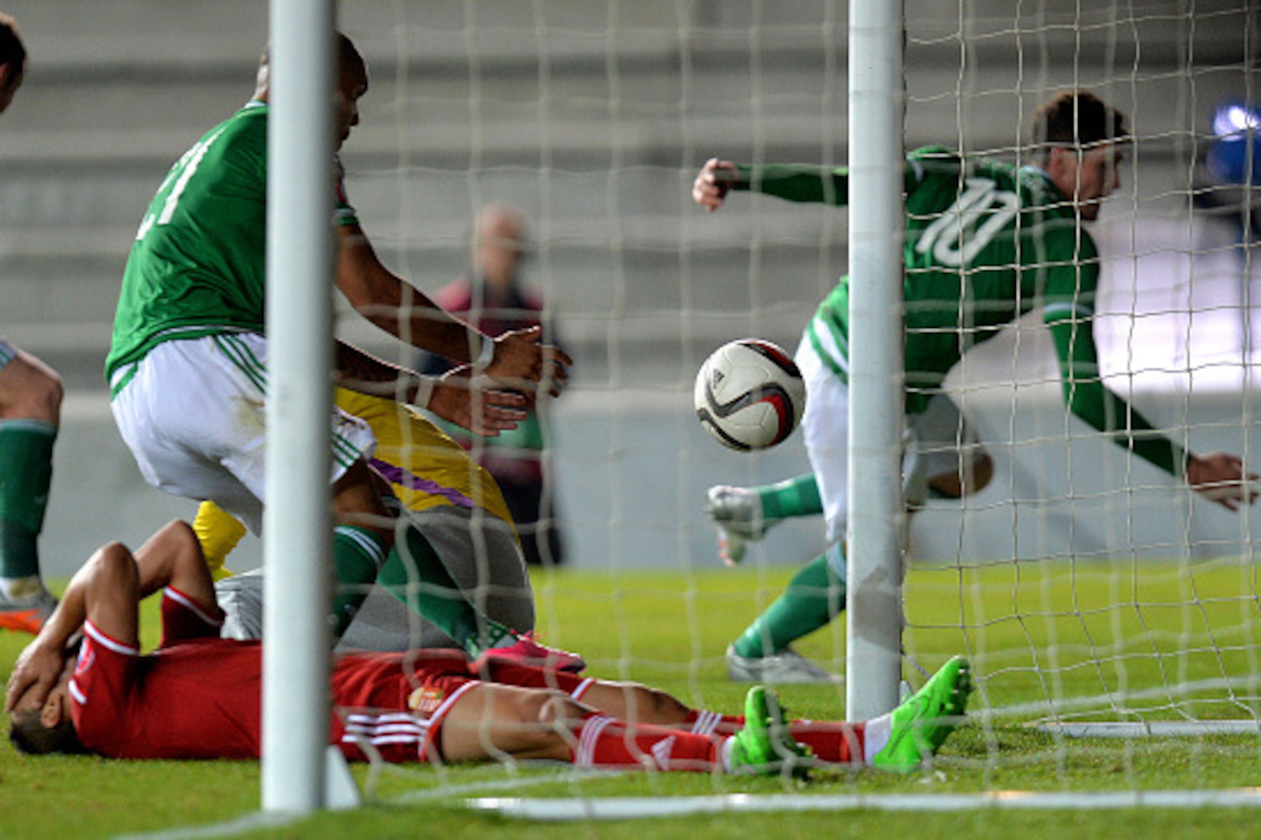 BELFAST, NORTHERN IRELAND - SEPTEMBER 7:  Kyle Lafferty (R) of Northern Ireland scores during the Euro 2016 Group F qualifying match between Northern Ireland and Hungary at Windsor Park on September 7, 2015 in Belfast, Northern Ireland.  (Photo by Charles