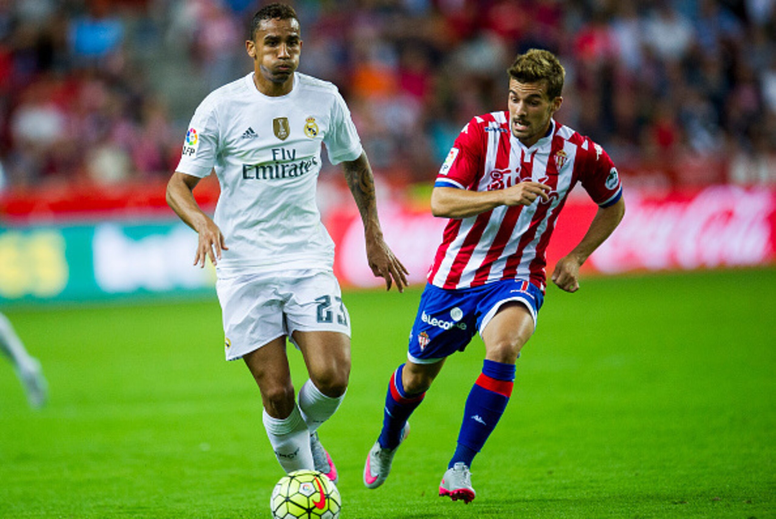 GIJON, SPAIN - AUGUST 23:  Danilo of Real Madrid duels for the ball with Juan Muniz of Real Sporting de Gijon during the La Liga match between Sporting Gijon and Real Madrid at Estadio El Molinon on August 23, 2015 in Gijon, Spain.  (Photo by Juan Manuel 
