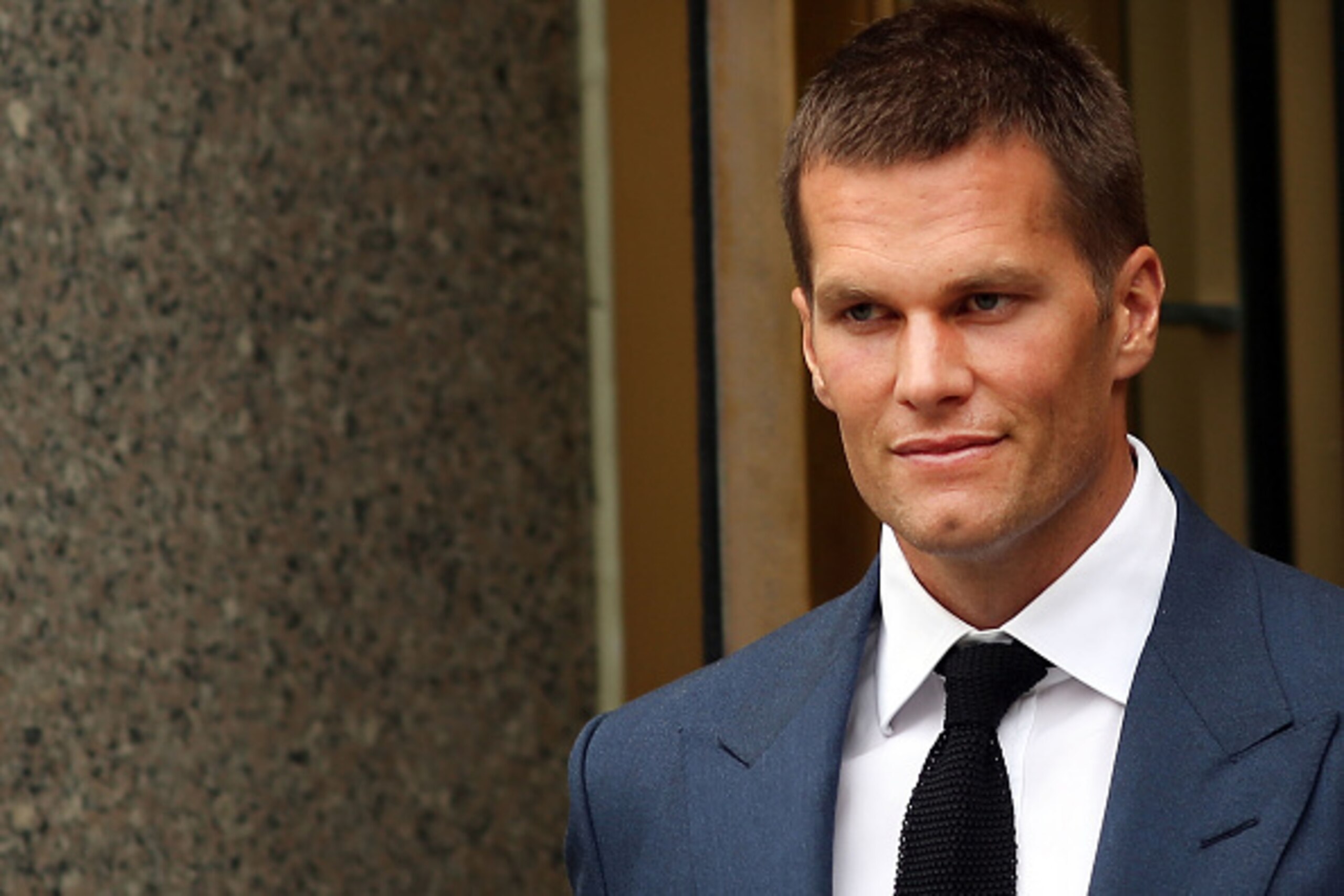 NEW YORK, NY - AUGUST 31: Quarterback Tom Brady of the New England Patriots leaves federal court after contesting his four game suspension with the NFL on August 31, 2015 in New York City. U.S. District Judge Richard Berman had required NFL commissioner NEW YORK, NY - AUGUST 31: Quarterback Tom Brady of the New England Patriots leaves federal court after contesting his four game suspension with the NFL on August 31, 2015 in New York City. U.S. District Judge Richard Berman had required NFL commissioner