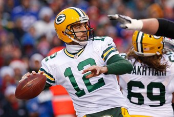Dec 14, 2014; Orchard Park, NY, USA; Green Bay Packers quarterback Aaron Rodgers (12) drops back to pass during the second half against the Buffalo Bills at Ralph Wilson Stadium. The Bills beat the Packers 21-13. Mandatory Credit: Kevin Hoffman-USA TODAY