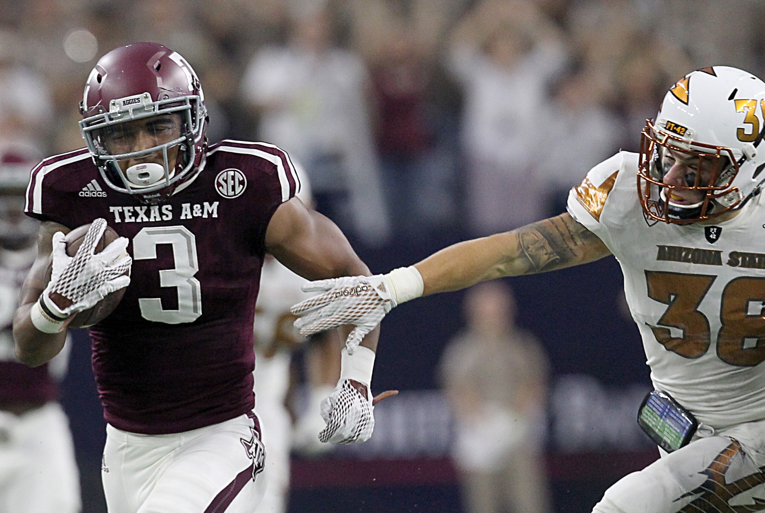 Sep 5, 2015; Houston, TX, USA;  Texas A&M Aggies kick returner Christian Kirk (3) breaks the tackle of Arizona State Sun Devils linebacker Luke Williams (36) and returns the punt for a 79 yard touchdown in the second quarter at NRG Stadium. Mandatory Cred