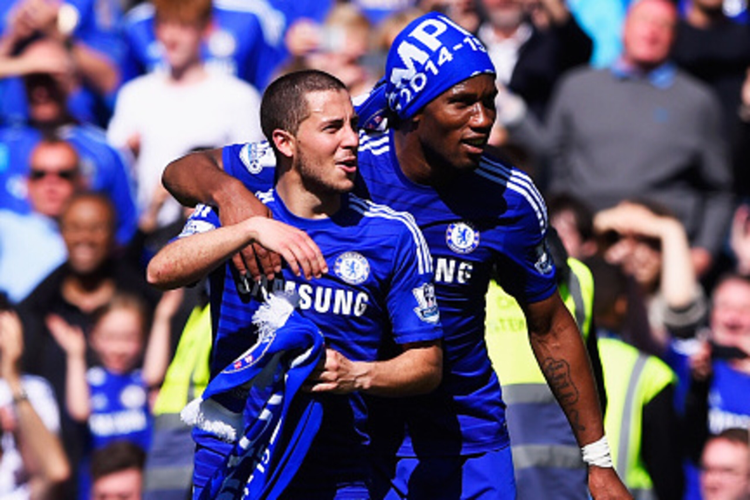 LONDON, ENGLAND - MAY 03:  Eden Hazard (L) and Didier Drogba of Chelsea celebrate winning the Premier League title after the Barclays Premier League match between Chelsea and Crystal Palace at Stamford Bridge on May 3, 2015 in London, England. Chelsea bec