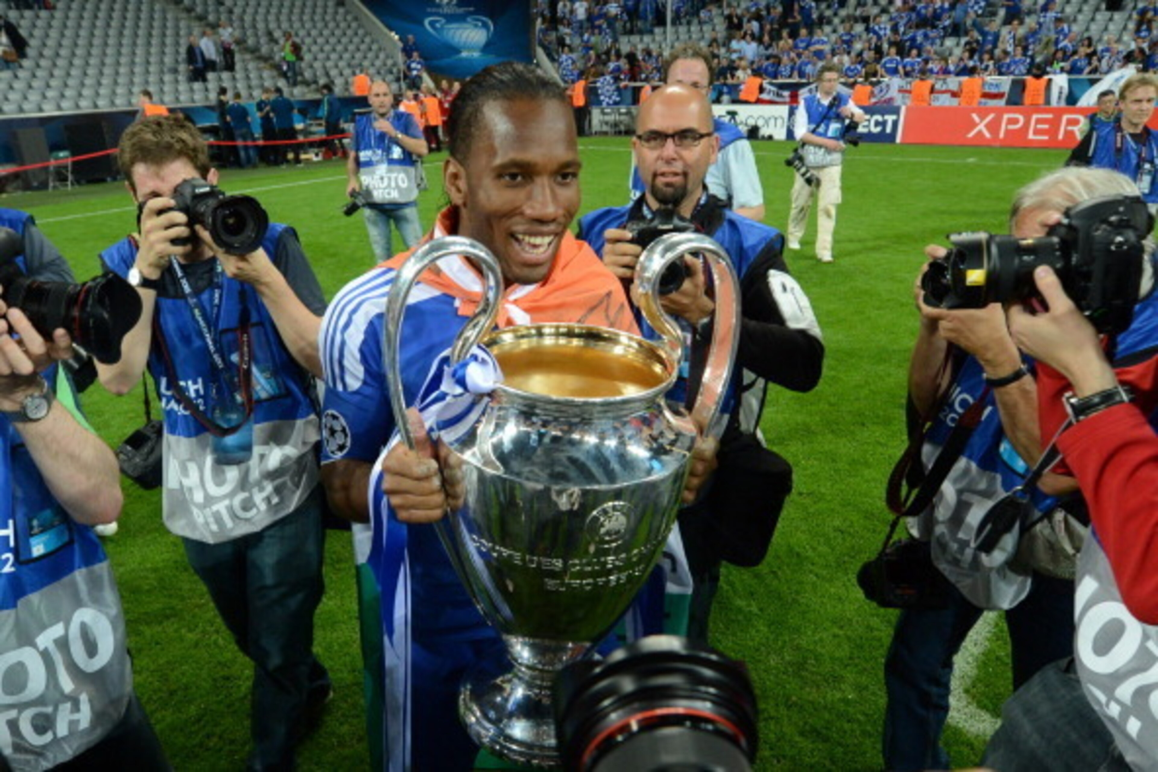 Chelsea's Ivorian forward Didier Drogba  holds the trophy after the UEFA Champions League final football match between FC Bayern Muenchen and Chelsea FC on May 19, 2012 at the Fussball Arena stadium in Munich.  Chelsea won 4-3 in the penalty phase.  AFP P