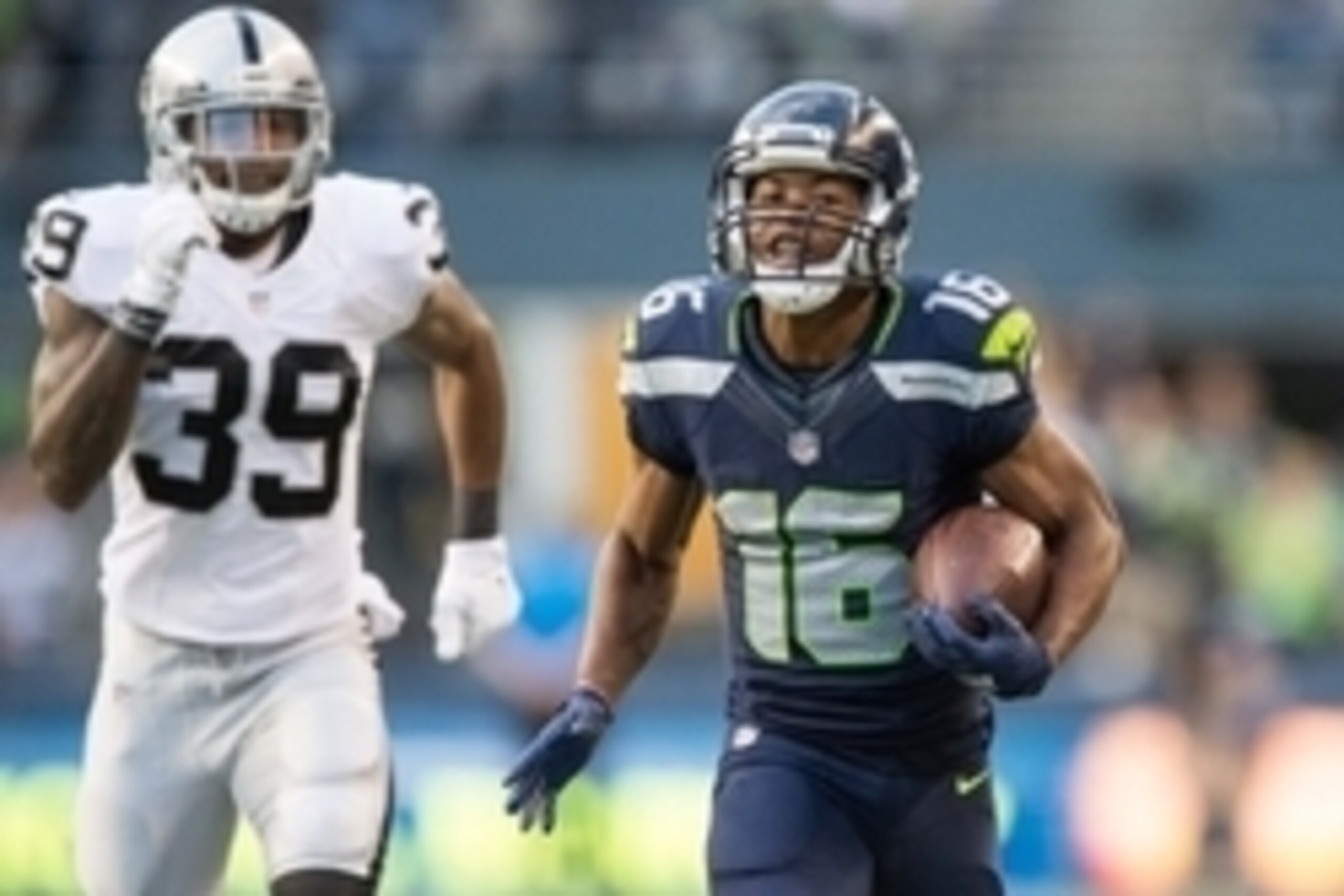 Sep 3, 2015; Seattle, WA, USA; Seattle Seahawks wide receiver Tyler Lockett (16) scores a touchdown as he is pursued by Oakland Raiders cornerback Keith McGill (39) during the first quarter at CenturyLink Field. Mandatory Credit: Troy Wayrynen-USA TODAY S