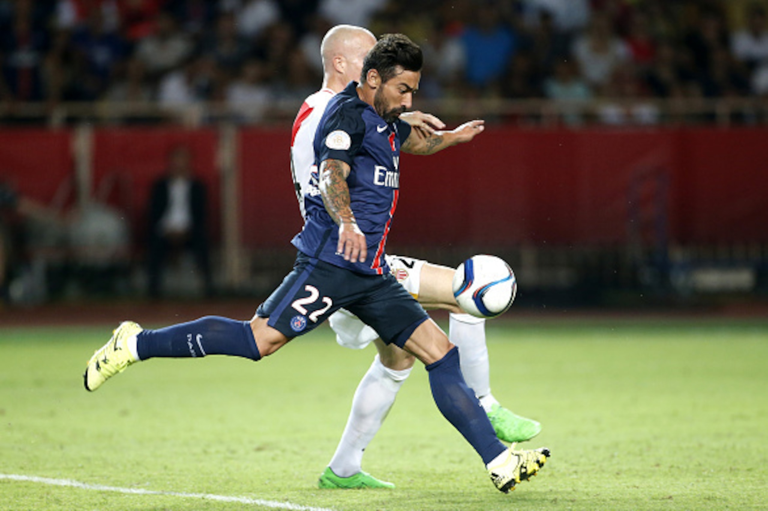 MONACO - AUGUST 30: Ezequiel Lavezzi of PSG scores a goal despite Andrea Raggi of Monaco during the French Ligue 1 match between AS Monaco and Paris Saint-Germain at Stade Louis II on August 30, 2015 in Monaco. (Photo by Jean Catuffe/Getty Images) MONACO - AUGUST 30: Ezequiel Lavezzi of PSG scores a goal despite Andrea Raggi of Monaco during the French Ligue 1 match between AS Monaco and Paris Saint-Germain at Stade Louis II on August 30, 2015 in Monaco. (Photo by Jean Catuffe/Getty Images)