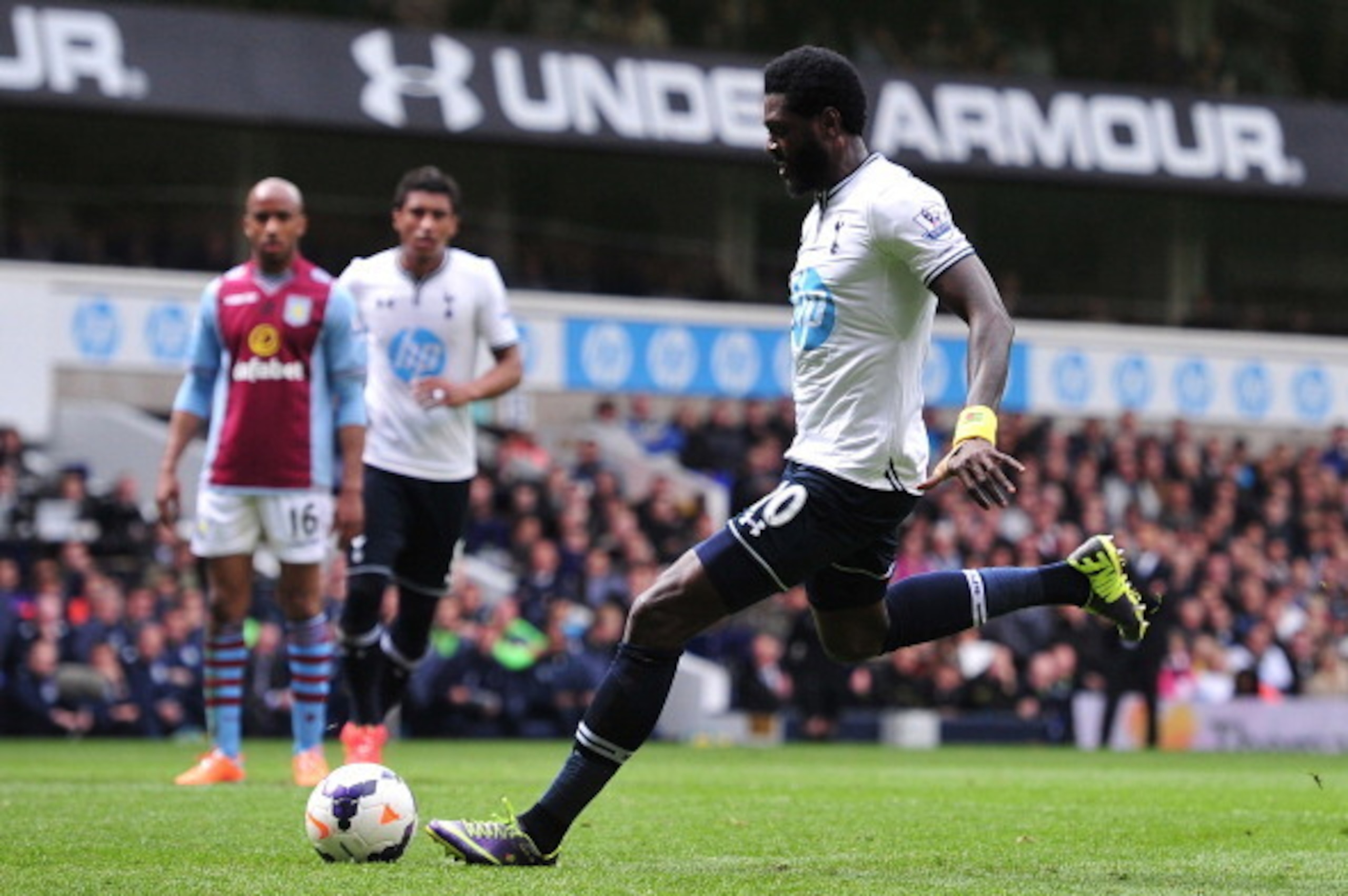 Tottenham Hotspur's Togolese striker Emmanuel Adebayor scores from a penalty during the English Premier League football match between Tottenham Hotspur and Aston Villa at White Hart Lane in London on May 11, 2014.  AFP PHOTO/CARL COURT - RESTRICTED TO EDI