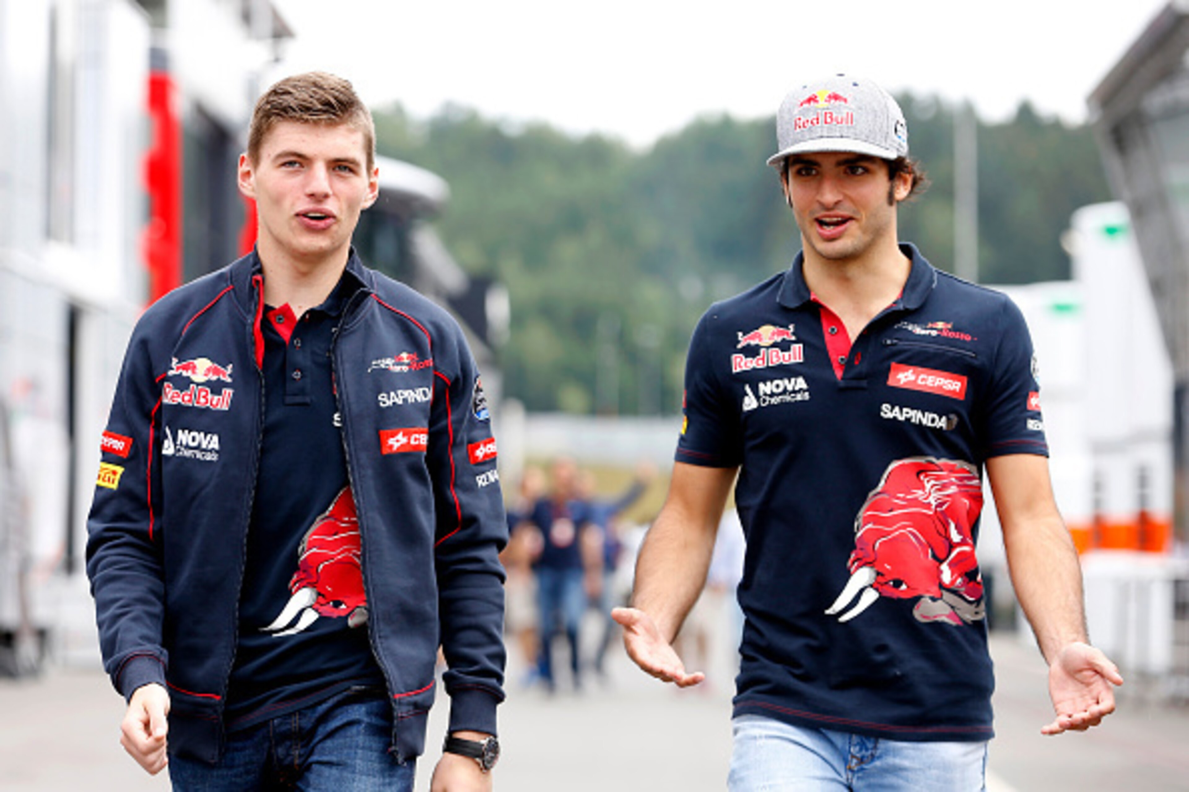 SPIELBERG, AUSTRIA - JUNE 18: Max Verstappen of Netherlands and Scuderia Toro Rosso and Carlos Sainz of Spain and Scuderia Toro Rosso speak as they walk in the paddock during previews to the Formula One Grand Prix of Austria at Red Bull Ring on June 18, SPIELBERG, AUSTRIA - JUNE 18: Max Verstappen of Netherlands and Scuderia Toro Rosso and Carlos Sainz of Spain and Scuderia Toro Rosso speak as they walk in the paddock during previews to the Formula One Grand Prix of Austria at Red Bull Ring on June 18,