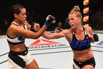 SAN DIEGO, CA - JULY 15:   (R-L) Holly Holm punches Marion Reneau in their women's bantamweight bout during the UFC event at the Valley View Casino Center on July 15, 2015 in San Diego, California. (Photo by Jeff Bottari/Zuffa LLC/Zuffa LLC via Getty Imag