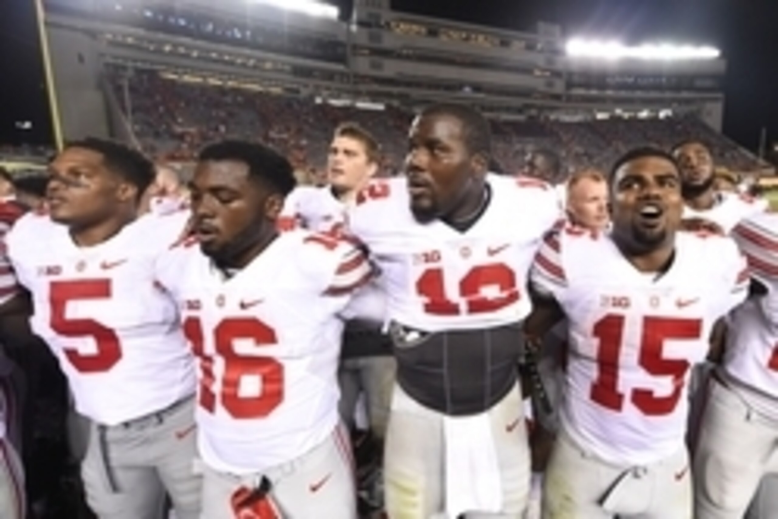Sep 7, 2015; Blacksburg, VA, USA; Ohio State Buckeyes linebacker Raekwon McMillan (5) and quarterback J.T. Barrett (16) and quarterback Cardale Jones (12) and running back Ezekiel Elliott (15) after the game. The Ohio State Buckeyes defeated the Virginia 