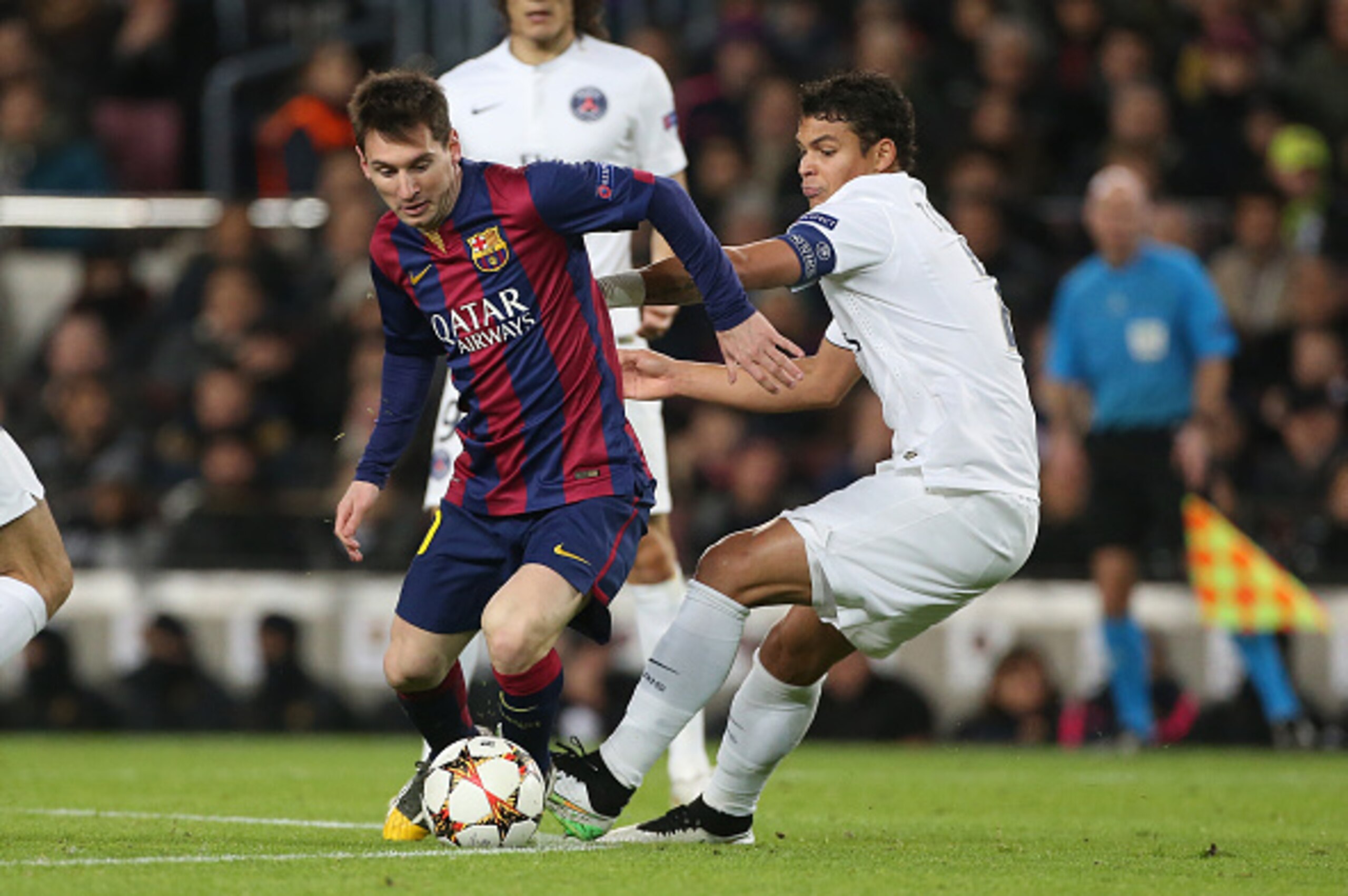 BARCELONA, SPAIN - DECEMBER 10: Lionel Messi of Barcelona and Thiago Silva of PSG in action to the UEFA Champions League Group F match between FC Barcelona and Paris Saint-Germain FC at Camp Nou stadium on December 10, 2014 in Barcelona, Spain. (Photo by 
