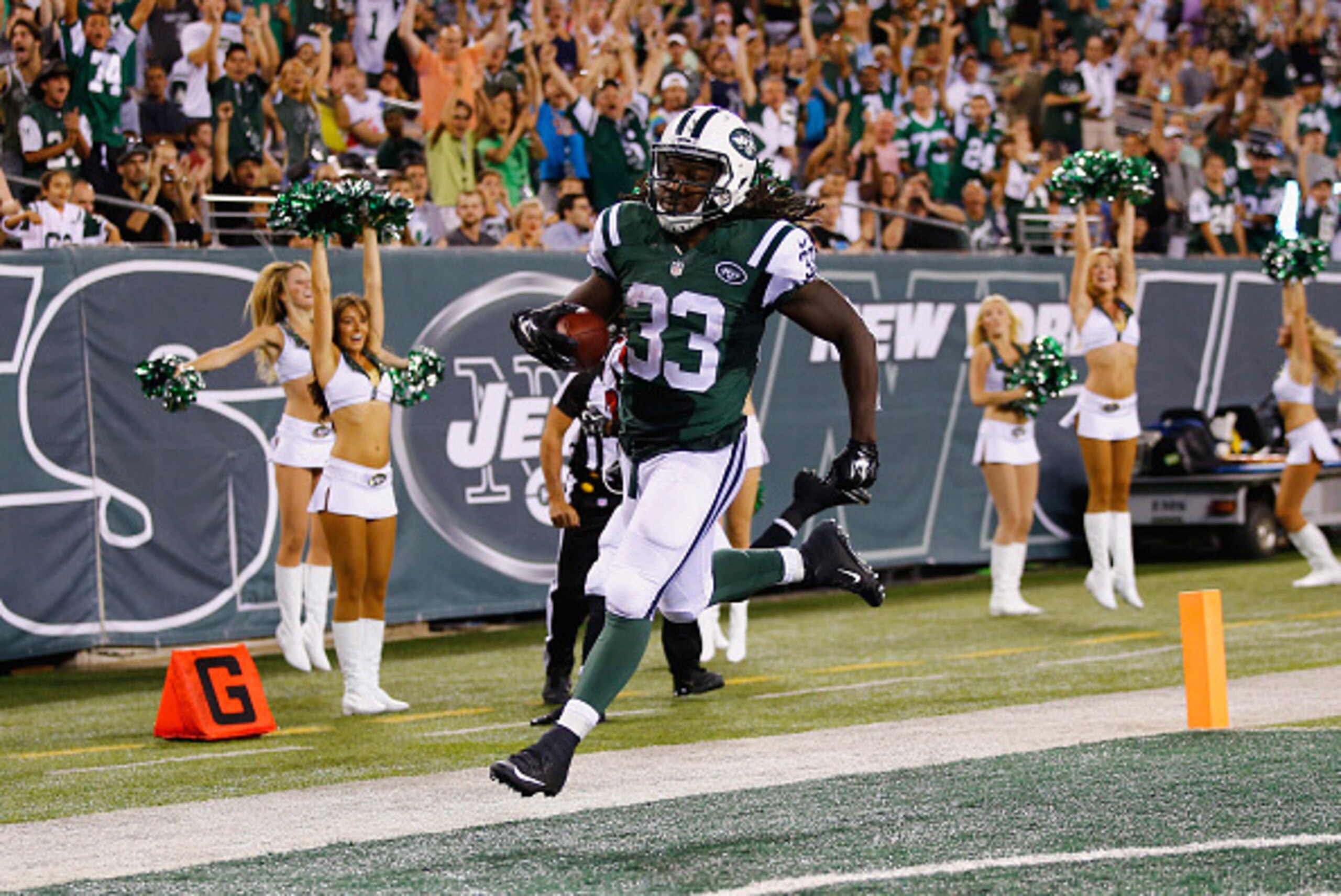 EAST RUTHERFORD, NJ - AUGUST 21:  Chris Ivory #33 of the New York Jets scores a touchdown against the Atlanta Falcons in the second quarter during their pre season game at MetLife Stadium on August 21, 2015 in East Rutherford, New Jersey.  (Photo by Al Be