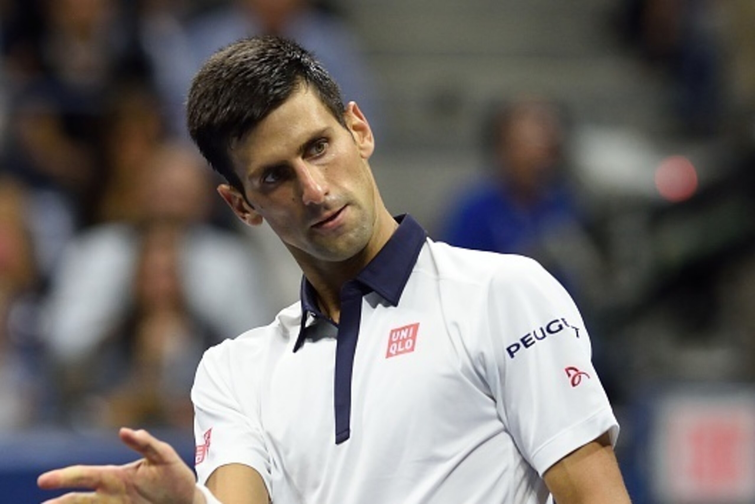 Novak Djokovic of Serbia reacts to a point while playing Roberto Bautista Agut from Spain  during their US Open 2015 fourth round men's singles match at the USTA Billie Jean King National Tennis Center on September 6, 2015  in New York. AFP PHOTO/DON EMME