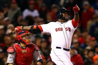 BOSTON, MA - OCTOBER 23:  David Ortiz #34 of the Boston Red Sox hits a home run in the seventh inning against the St. Louis Cardinals during Game One of the 2013 World Series at Fenway Park on October 23, 2013 in Boston, Massachusetts.  (Photo by Elsa/Get