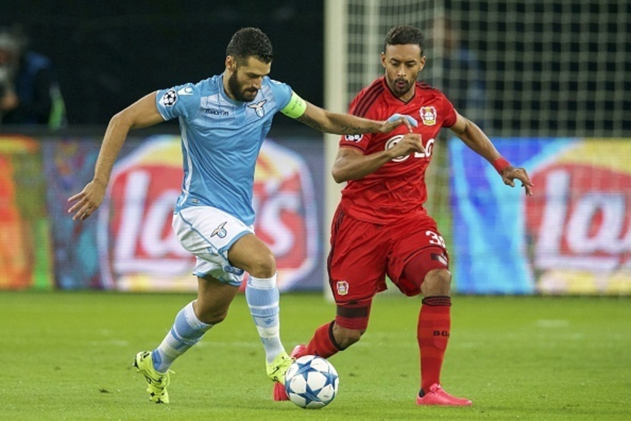(L-R) Antonio Candreva of SS Lazio, Karim Bellarabi of Bayer Leverkusen during the UEFA Champions League play-offs match between Bayer Leverkusen and Lazio Roma on August 26, 2015 at the BayArena in Leverkusen, Germany.(Photo by VI Images via Getty Images