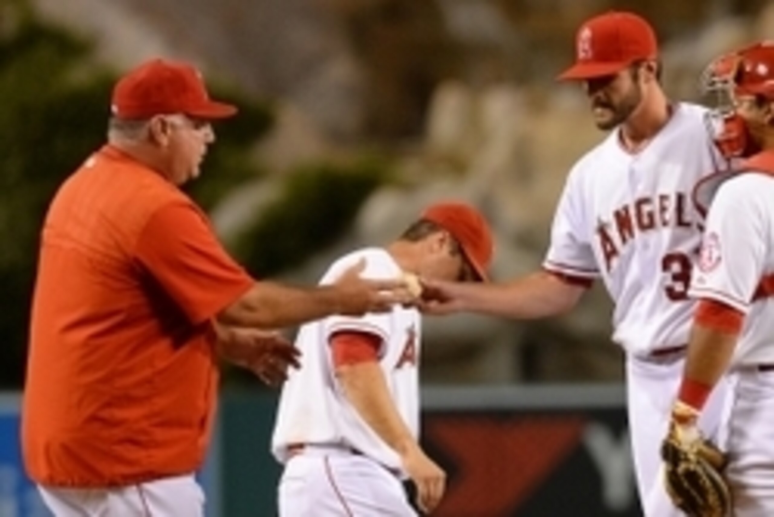 Sep 7, 2015; Anaheim, CA, USA; Los Angeles Angels manager Mike Scioscia (14) pulls starting pitcher Nick Tropeano (35) in the fifth inning of the game against the Los Angeles Dodgers at Angel Stadium of Anaheim. Mandatory Credit: Jayne Kamin-Oncea-USA TOD Sep 7, 2015; Anaheim, CA, USA; Los Angeles Angels manager Mike Scioscia (14) pulls starting pitcher Nick Tropeano (35) in the fifth inning of the game against the Los Angeles Dodgers at Angel Stadium of Anaheim. Mandatory Credit: Jayne Kamin-Oncea-USA TOD