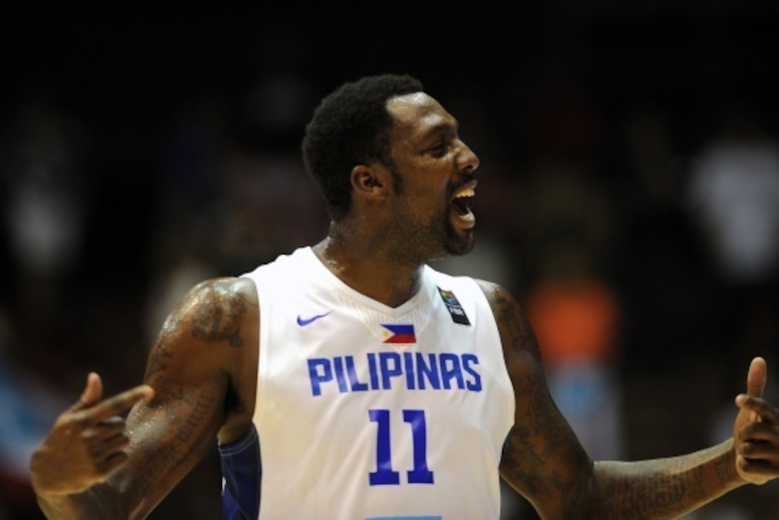 Philippines' centre Andray Blatche gestures during the 2014 FIBA World basketball championships group B match Philippines vs Puerto Rico at the Palacio Municipal de Deportes in Sevilla on September 3, 2014. AFP PHOTO/ CRISTINA QUICLER        (Photo credit