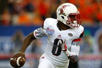 ATLANTA, GA - SEPTEMBER 05:  Lamar Jackson #8 of the Louisville Cardinals rolls away from the Auburn Tigers at Georgia Dome on September 5, 2015 in Atlanta, Georgia.  (Photo by Kevin C. Cox/Getty Images)