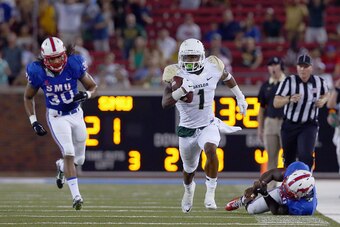 DALLAS, TX - SEPTEMBER 04:  Corey Coleman #1 of the Baylor Bears carries the ball and scores a touchdown against Robert Seals #30 of the Southern Methodist Mustangs and Jonathan Yenga #1 of the Southern Methodist Mustangs in the second half at Gerald J. F