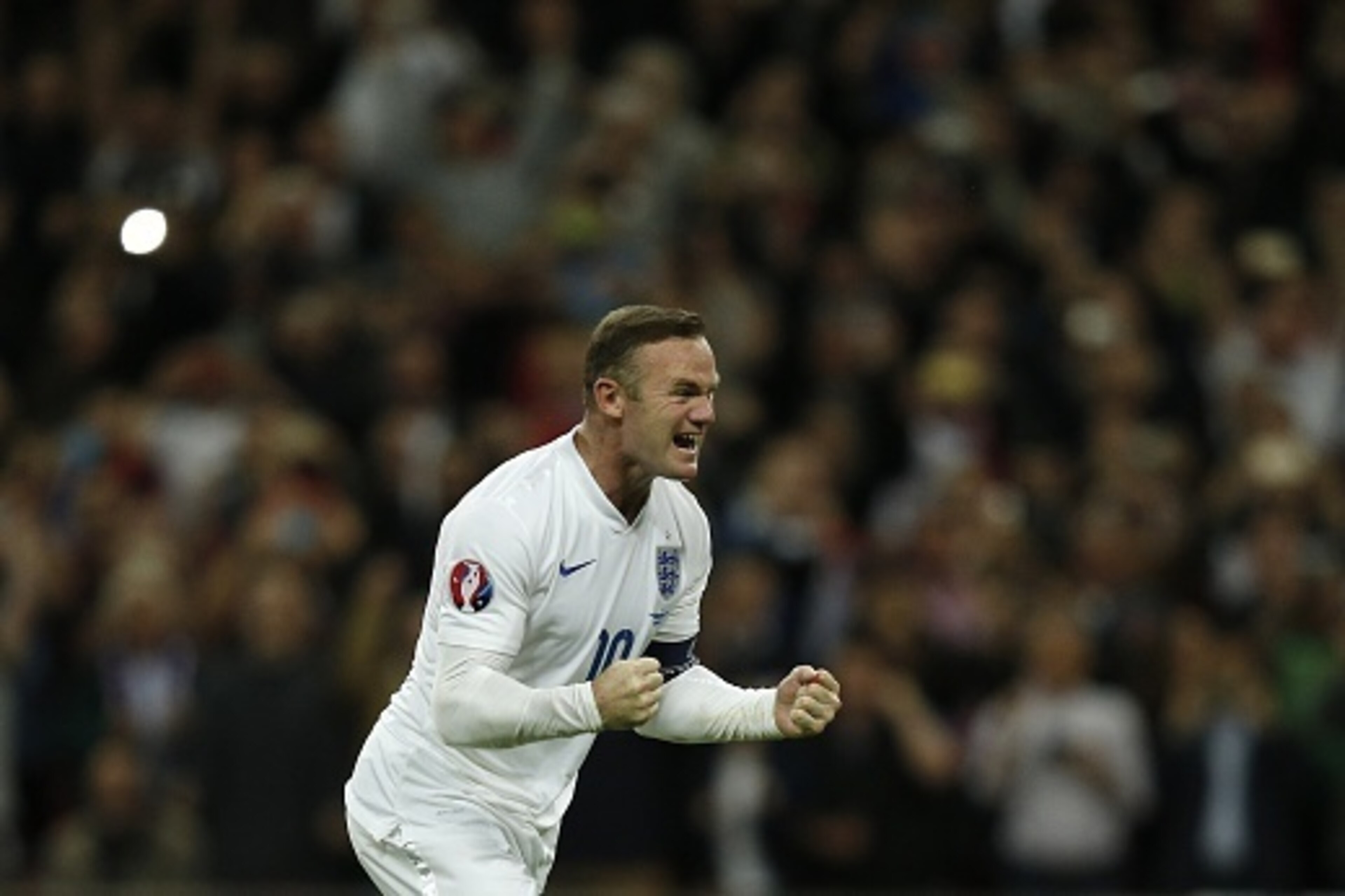 England's striker Wayne Rooney celebrates after scoring from the penalty spot to score his 50th goal for England, making him the country's all-time goal scorer, during the Euro 2016 qualifying group E football match between England and Switzerland at Wemb