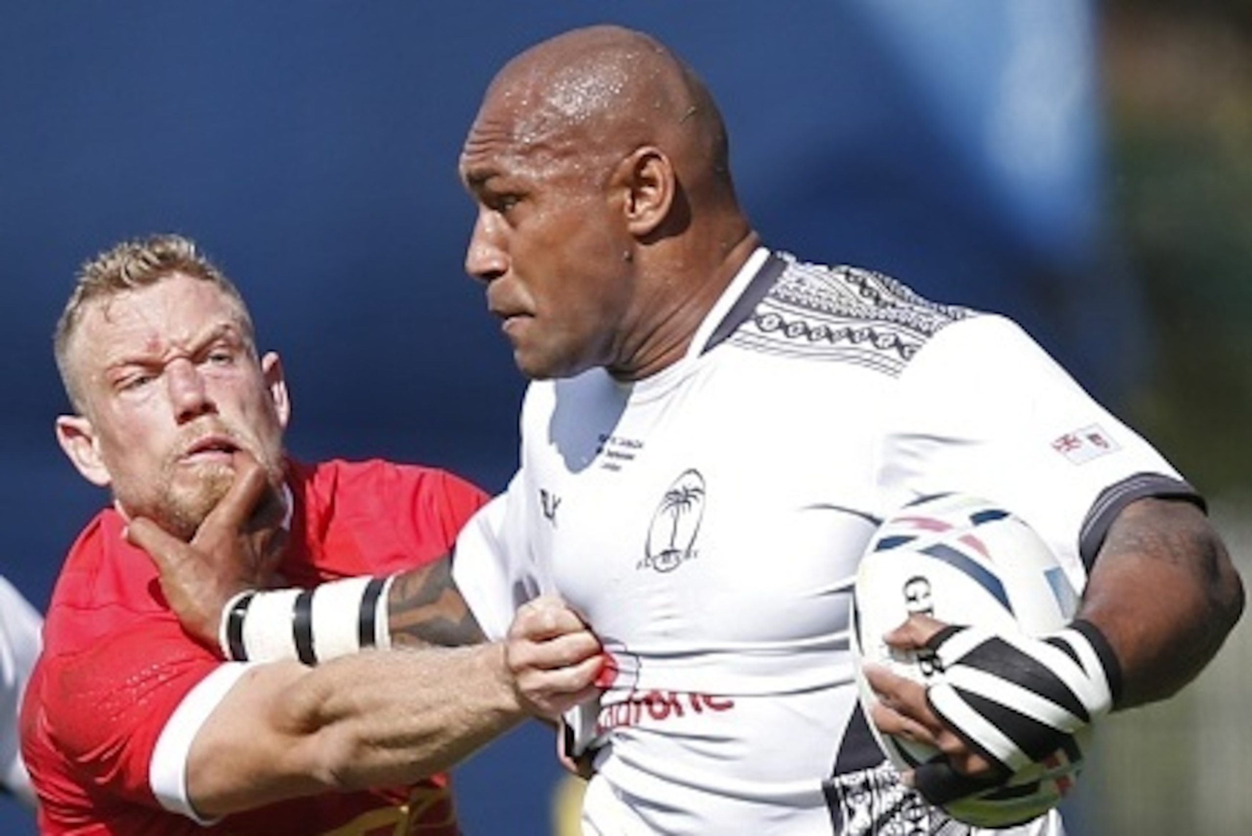 Fiji's wing Nemani Nadolo (R) hands-off Canada's wing DTH van der Merwe during the international rugby union friendly match between Canada and Fiji, ahead of the 2015 Rugby World Cup, at The Stoop in Twickenham, west of London, on September 6, 2015. AFP P