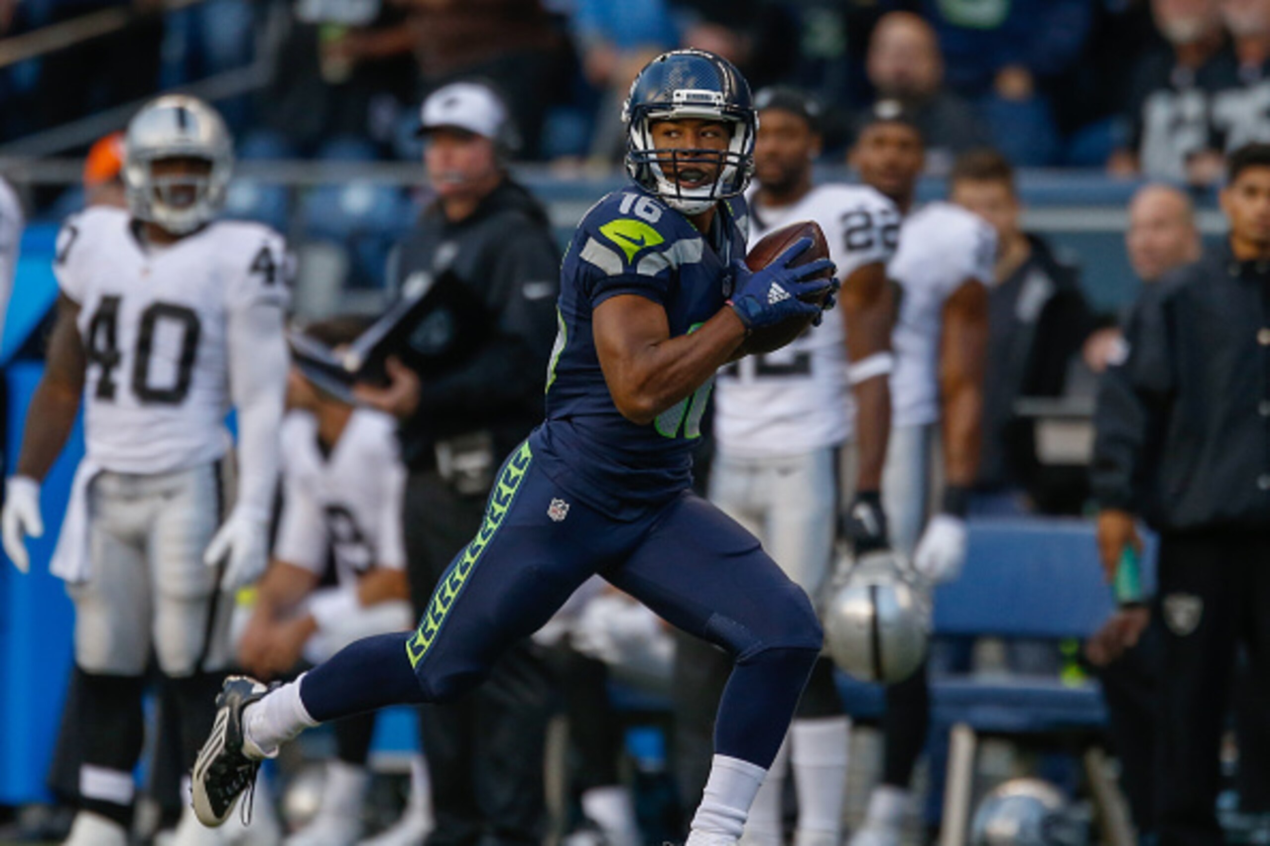 SEATTLE, WA - SEPTEMBER 03:  Wide receiver Tyler Lockett #16 of the Seattle Seahawks rushes for a touchdown on a 63 yard pass play in the first quarter against the Oakland Raiders at CenturyLink Field on September 3, 2015 in Seattle, Washington.  (Photo b