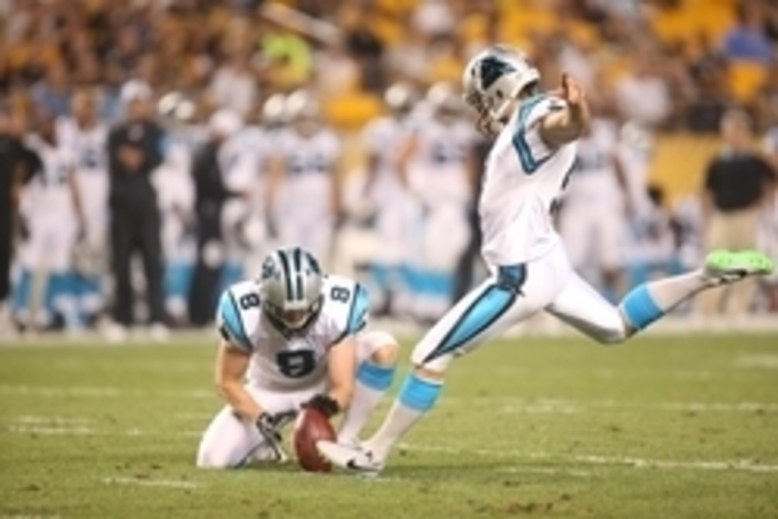 Sep 3, 2015; Pittsburgh, PA, USA; Carolina Panthers kicker Graham Gano (R) kicks a twenty-three yard field goal from the hold of punter Brad Nortman (8) against the Pittsburgh Steelers during the second quarter at Heinz Field. Mandatory Credit: Charles Le