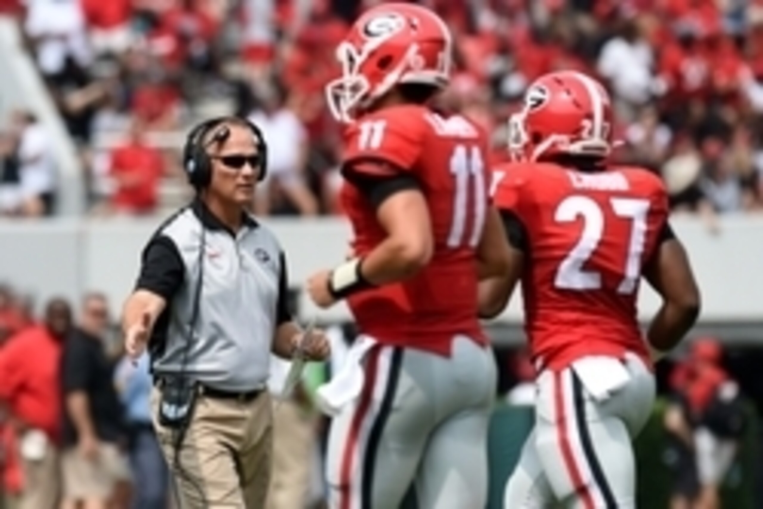 Sep 5, 2015; Athens, GA, USA; Georgia Bulldogs head coach Mark Richt reacts with quarterback Greyson Lambert (11) and running back Nick Chubb (27) after a touchdown against the Louisiana Monroe Warhawks during the first quarter at Sanford Stadium. Mandato