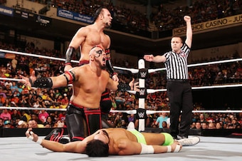 The Ascension gloat over a fallen Damien Sandow.