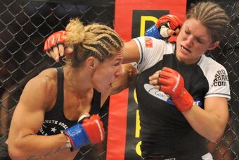SAN JOSE, CA - AUGUST 15:  Cris Cyborg (L) battles Gina Carano during their Middleweight Championship fight at Strikeforce: Carano vs. Cyborg on August 15, 2009 in San Jose, California.  (Photo by Jon Kopaloff/Getty Images)