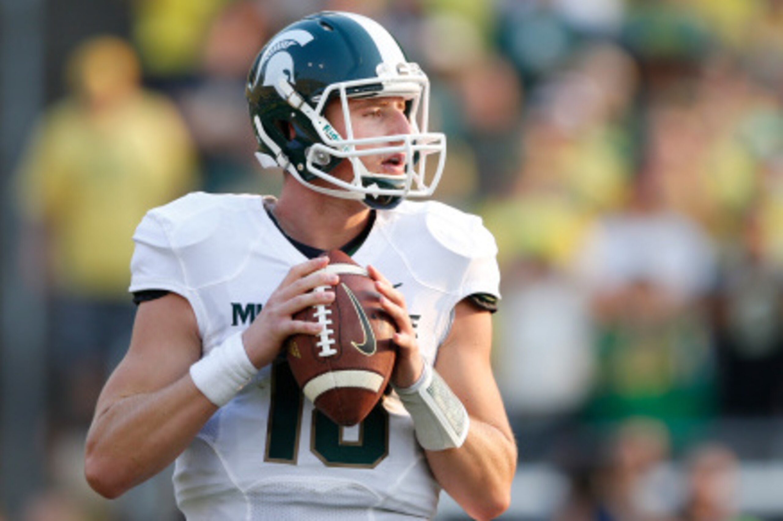 EUGENE, OR - SEPTEMBER 6: Connor Cook #18 of the Michigan State Spartans looks to pass the ball against the Oregon Ducks during the game at Autzen Stadium on September 6, 2014 in Eugene, Oregon. Oregon won 46-27. (Photo by Joe Robbins/Getty Images)