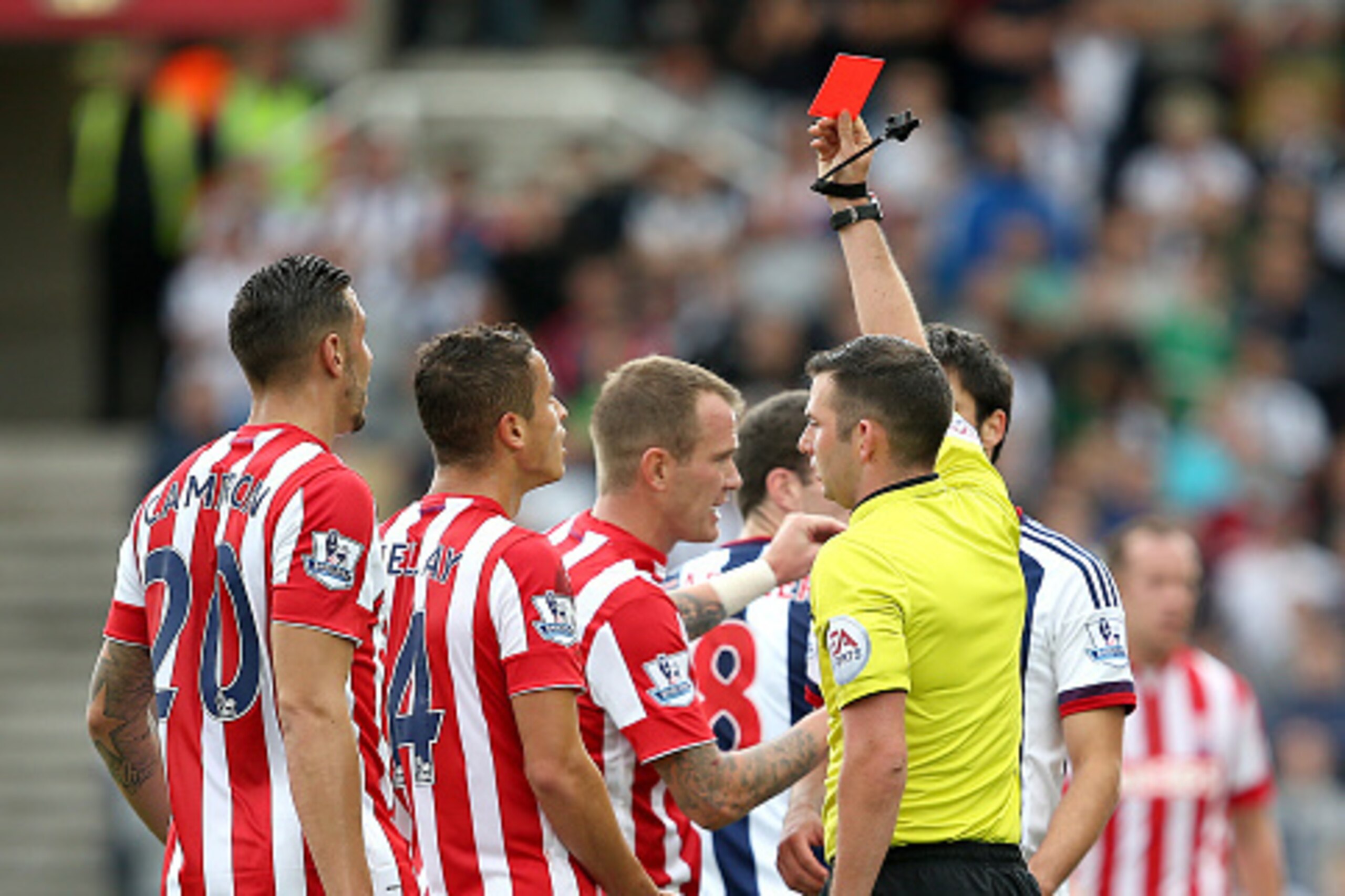 STOKE ON TRENT, ENGLAND - AUGUST 29:  Ibrahim Afellay of Stoke City is shown the red card by referee Michael Oliver during the Barclays Premier League match between Stoke City and West Bromwich Albion at Britannia Stadium on August 29, 2015 in Stoke on Tr