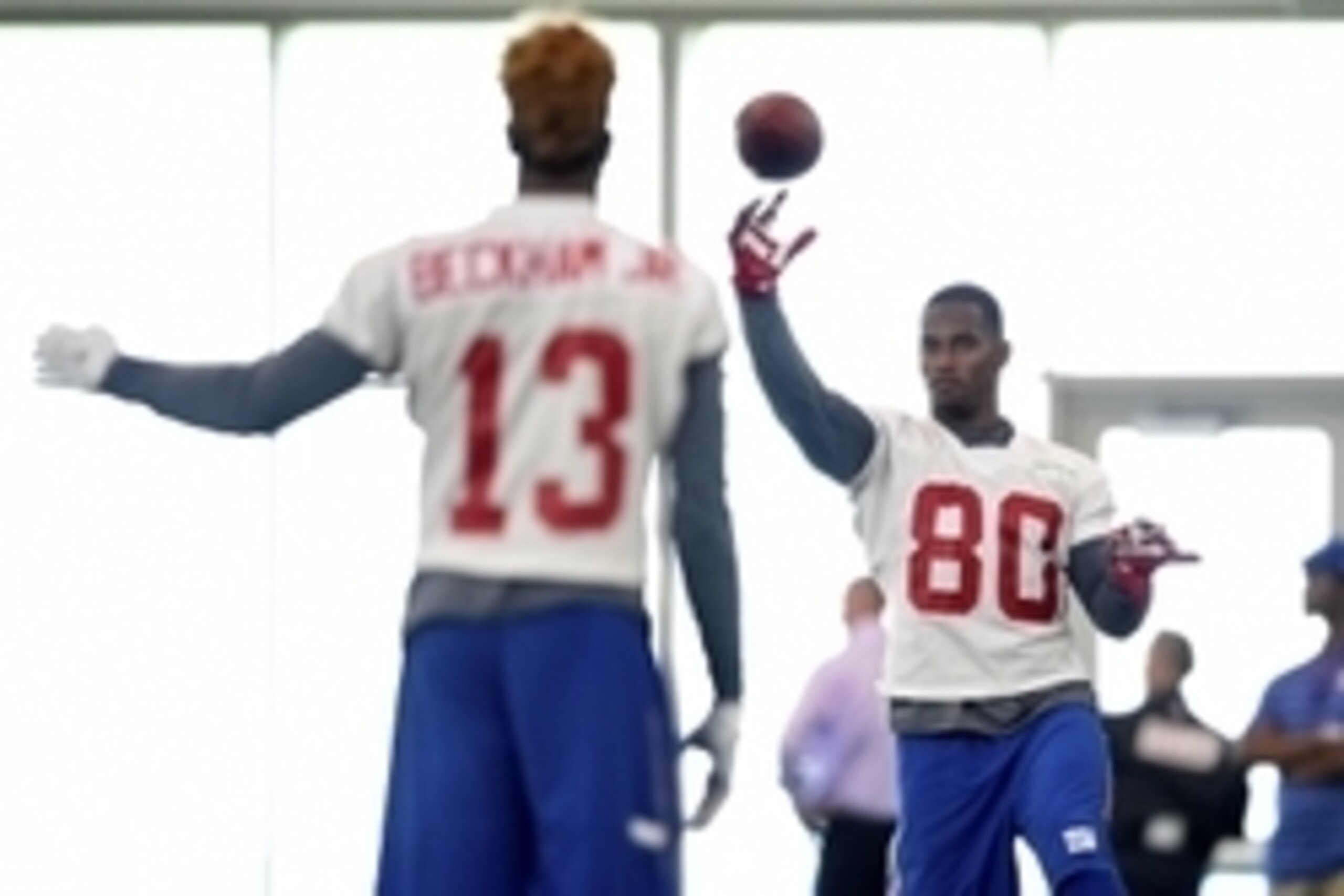 Jun 16, 2015; East Rutherford, NJ, USA; New York Giants wide receiver Odell Beckham Jr, (13) throws to wide receiver Victor Cruz (80) during minicamp at Quest Diagnostics Training Center. Mandatory Credit: Steven Ryan-USA TODAY Sports