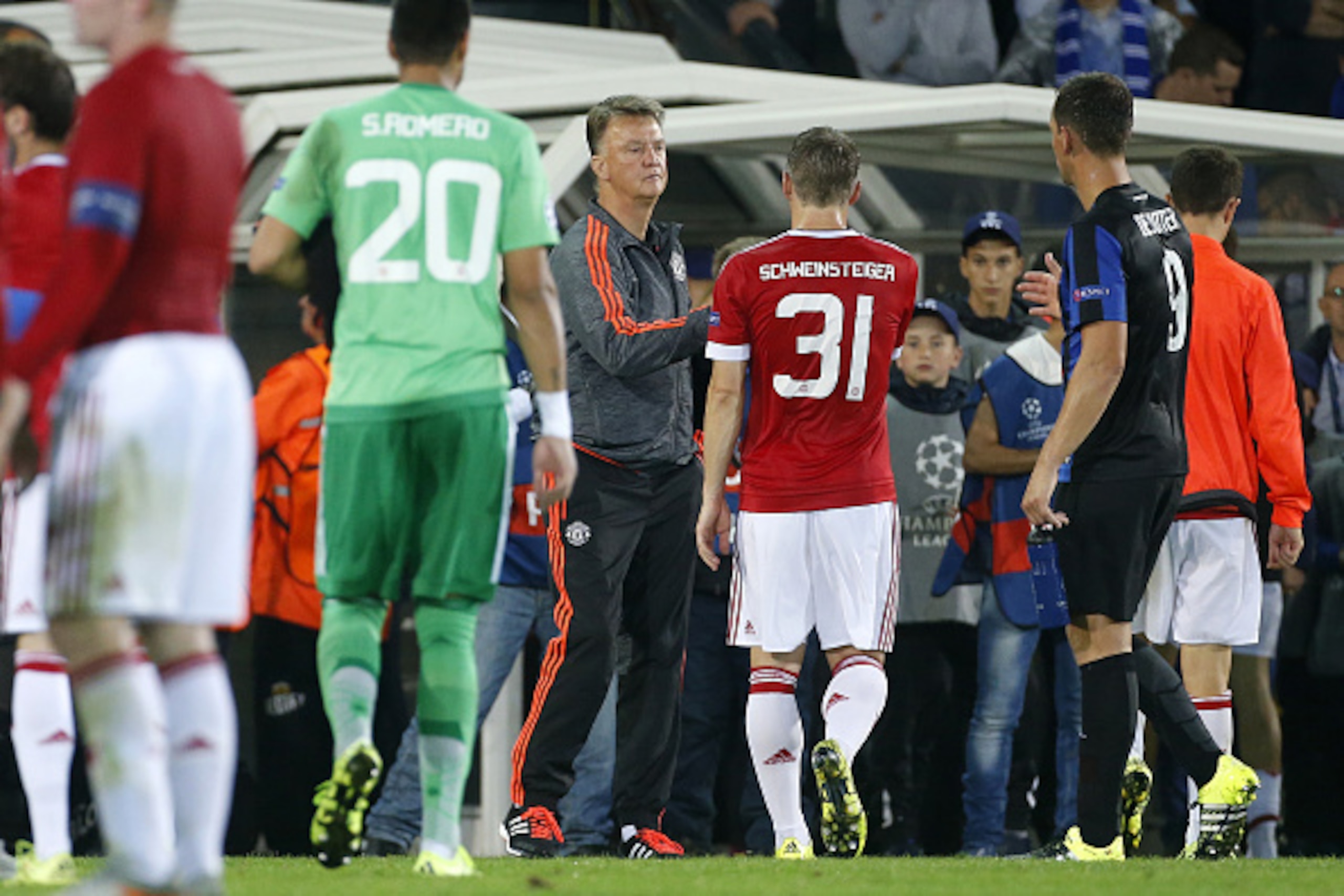 BRUGGE - AUGUST 26: Coach of Manchester United Louis van Gaal congratulates Bastian Schweinsteiger of Manchester United after the UEFA Champions League play off round 2nd leg between Club Brugge KV and Manchester United on August 26, 2015 in Brugge, Belgi