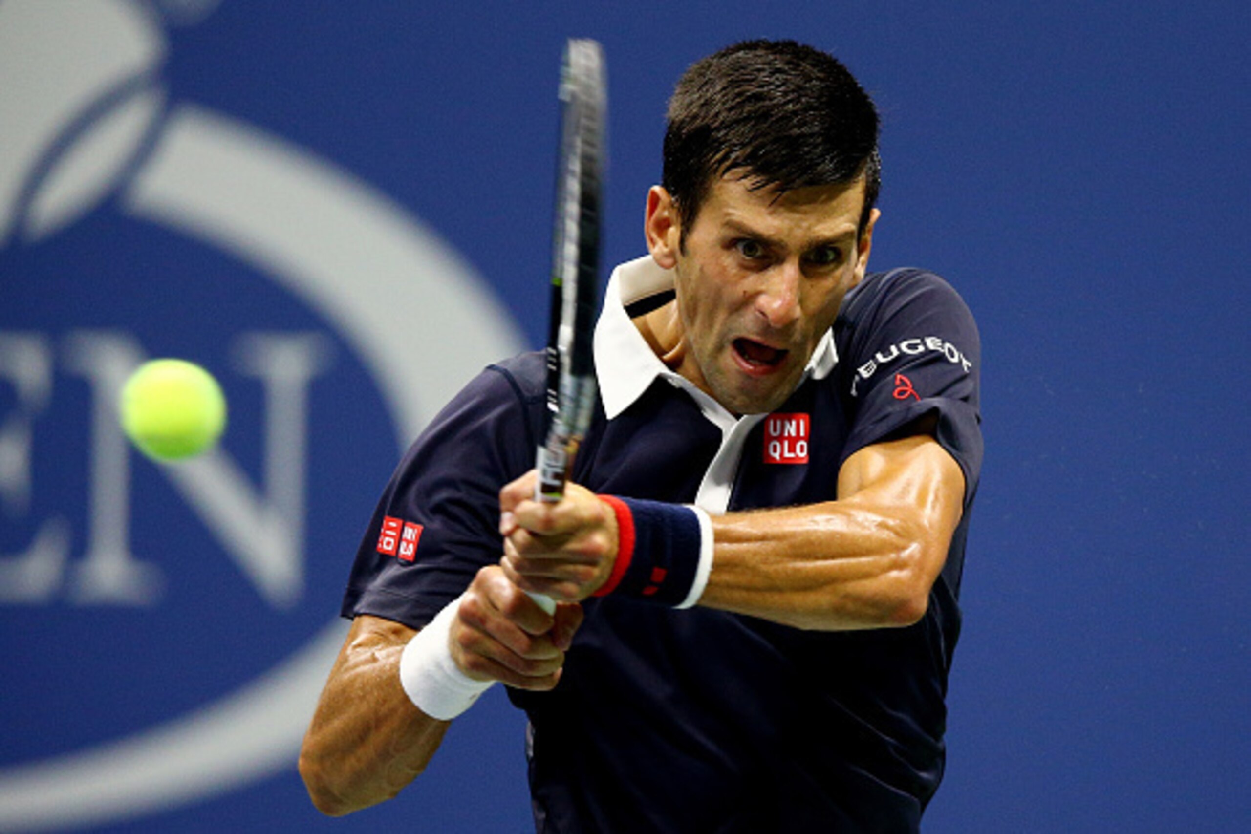 NEW YORK, NY - SEPTEMBER 08:  Novak Djokovic of Serbia returns a shot to Feliciano Lopez of Spain during their Men's Singles Quarterfinals match on Day Nine of the 2015 US Open at the USTA Billie Jean King National Tennis Center on September 8, 2015 in th