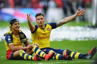 LONDON, ENGLAND - MAY 30:  Alexis Sanchez and Olivier Giroud of Arsenal celebrate victory after the FA Cup Final between Aston Villa and Arsenal at Wembley Stadium on May 30, 2015 in London, England. Arsenal beat Aston Villa 4-0.  (Photo by Shaun Botteril