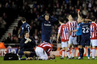 STOKE ON TRENT, ENGLAND - FEBRUARY 27:  Ryan Shawcross of Stoke City is sent off by Referee Peter Walton for a challenge on Aaron Ramsey of Arsenal during the Barclays Premier League match between Stoke City and Arsenal at The Britannia Stadium on Februar
